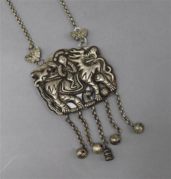 A white metal necklace and pendant